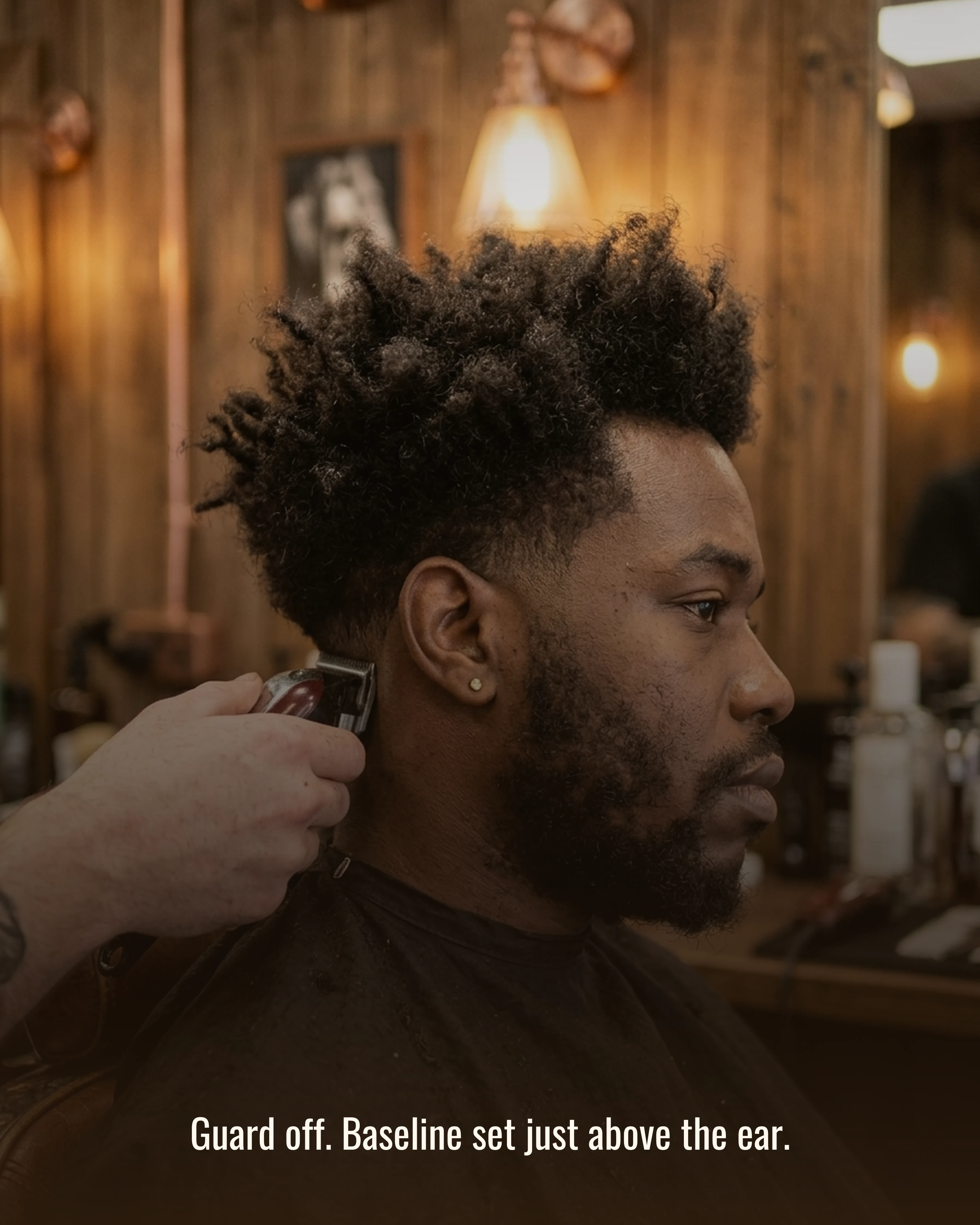 Clippers setting a baseline just above the client's ear
