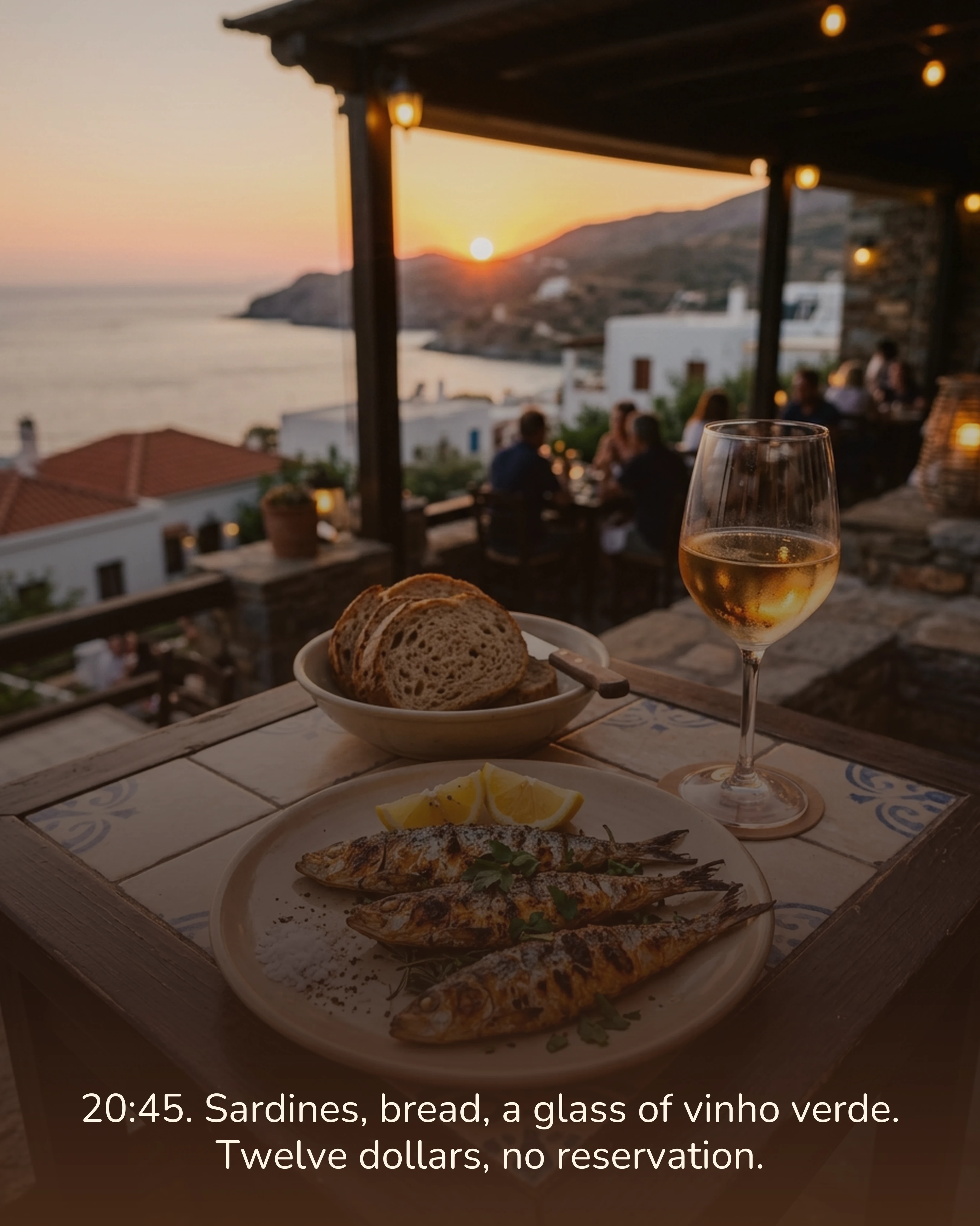 Grilled sardines and wine at a tiled restaurant table